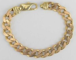 A 9ct rose gold flat curb bracelet with lobster claw clasp, length 18.5cm, approx 32.3g.