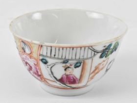 An 18th century Chinese Export Famille Rose porcelain tea bowl decorated to the sides with a panel