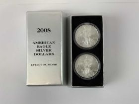A 2008 American Eagle silver dollar set comprising two 1oz silver dollars.