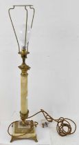 An onyx and gilt metal mounted table lamp, height to top of fitment 50cm.