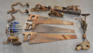 A small quantity of vintage tools including three saws, vices, lathes etc.