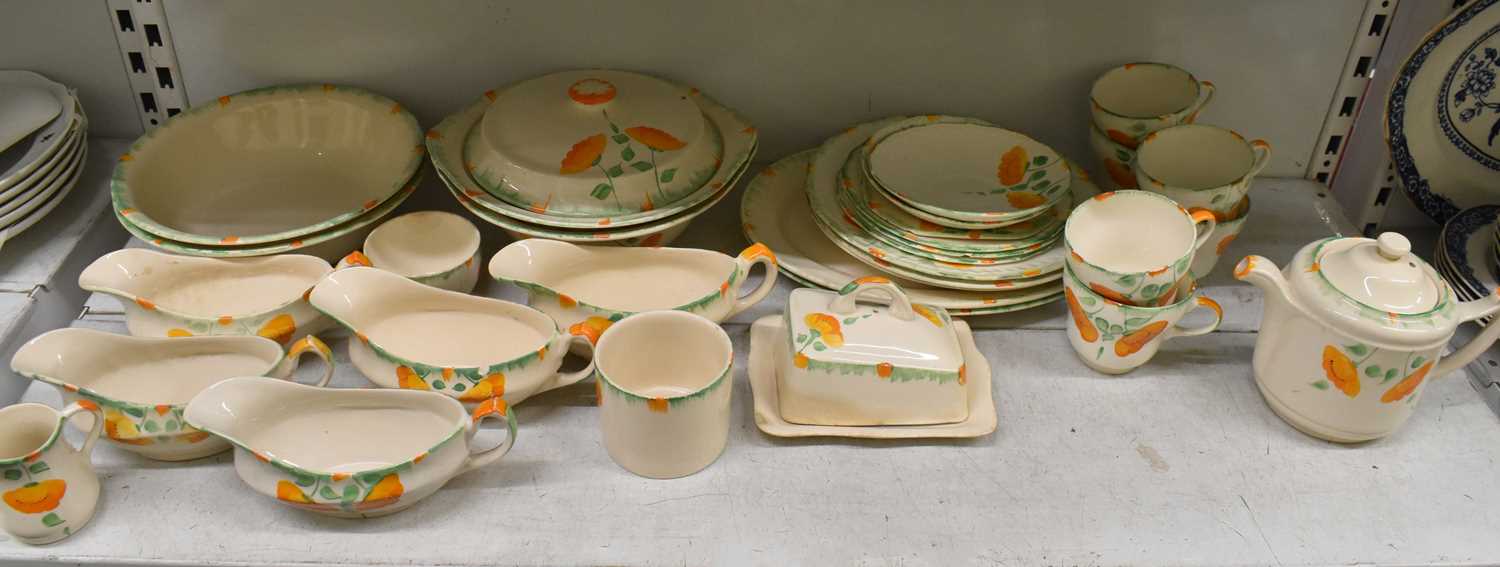 CLARICE CLIFF FOR NEWPORT POTTERY; a part tea and dinner service comprising two teacups, three