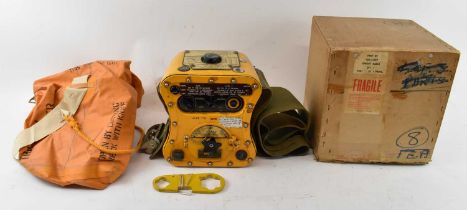 A WWII radio transmitter for use in aircrafts and dinghies, in original box and with waterproof bag.