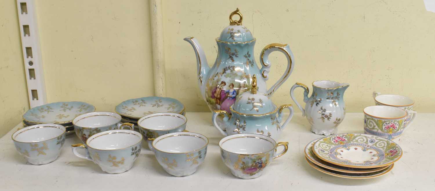 ROYAL WORCESTER; a pair of hand painted coffee cups on saucers and another matching saucer, and a