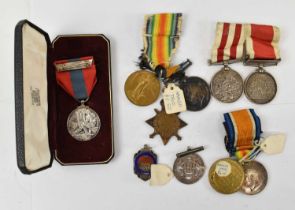 A group of WWI medals comprising a named trio of 1914-15 Star, War Medal and Victory Medal awarded