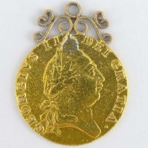 A 1787 George II gold guinea with yellow metal pendant mount, approx 8.95g.