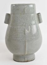 A Chinese celadon glazed Guan type vase, height 18cm, contained in wooden case.