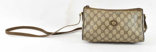 GUCCI; a lady's Italian 'GG' monogram bag with leather strap, width 24.5cm, height 14cm, depth 11.
