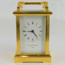 MAPPIN & WEBB, LONDON; a brass cased carriage clock, the white dial set with Roman numerals, key