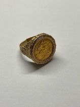 A George V 1911 half sovereign in yellow metal ring mount, size P, approx 10.4g.