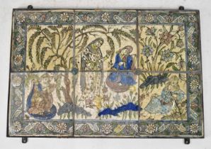 A set of six 18th/19th century Persian tiles mortared and framed as one, depicting four figures in a