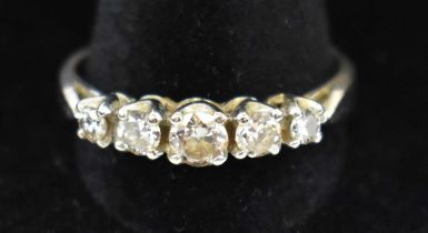 An 18ct white gold five stone diamond ring, total approx. 0.8ct, size U, approx. 4.6g.