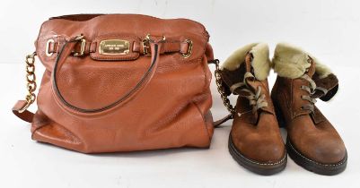 MICHAEL KORS; a tan leather handbag and a pair of Manas suede boots with faux fur lined interior,