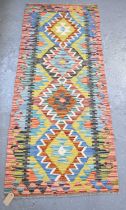 A handmade woollen Chobi Kilim runner, 150 x 63cm.