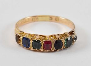 A 15ct yellow gold half eternity rainbow ring set with small diamond, two small emeralds, small ruby