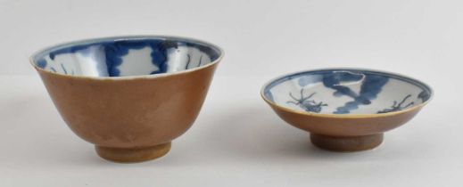 A late 19th century Chinese porcelain bowl and cover painted in underglaze blue to the interior with