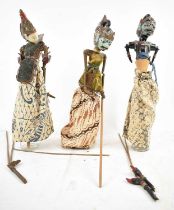 A group of three original Balinese puppets, each with painted detail and articulated limbs, height