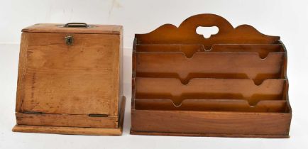 A 19th century pine stationery box, with lift-up top and fall front enclosing two drawers and