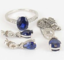 A suite of 9ct white gold diamond and sapphire jewellery, consisting of ring with claw set