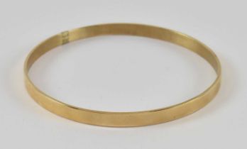 A 9ct yellow gold bangle, diameter 6.5cm, approx 11.9g.