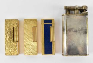 A group of three gold plated Dunhill lighters and large silver plated Dunhill lighter (4).