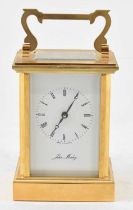 JOHN MORLEY; a modern brass cased carriage clock with handle to top, height to top of handle 15cm,