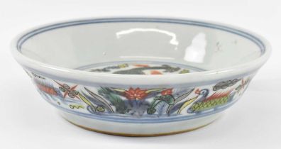 A 20th century Chinese porcelain Wucai Ming style shallow bowl decorated with a dragon to the
