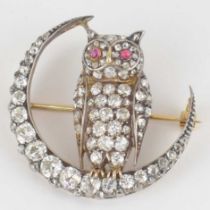 A yellow gold owl and crescent diamond brooch with ruby eyes, diameter of crescent 3.5cm, diamond