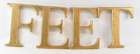 FEET; a group of four gilt decorated letters.
