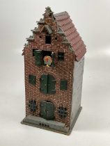 A Dutch or possibly German model of a warehouse with ground floor windows barred for security, green