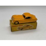 DINKY; a boxed Jaguar XK120, 157, yellow. Provenance: Messrs. Phillips Auctioneers, Dinky toys