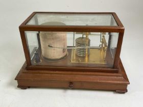 A barograph by Henry Hughes & Son Ltd, London, No 6528, contained within a mahogany and glass