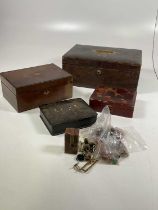 A leather travelling writing box, sewing box, and two lacquered boxes with contents.