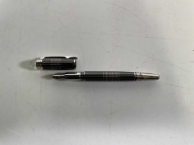 A black and silver Montblanc fountain pen, engraved to the nib 4810, 14K, Montblanc, 585, uncased.