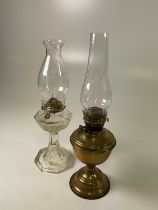 A brass oil lamp, height 51cm, and a glass lamp