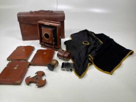 J. LANCASTER & SONS; a leather cased mahogany bodied brass mounted early plate camera, with plaque