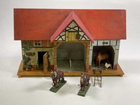 A German 'Red Roof' stable with half timbered hayloft above the central section, a room to the