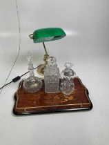A lacquered tray with three decanters (one a/f), and a library lamp