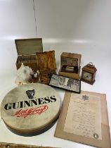 A mixed lot of collectors' items, including a Guinness drum, mantel clock, seashell, wooden gaming