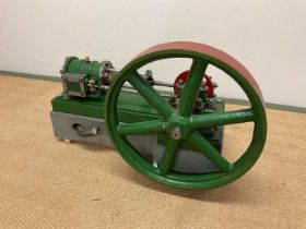 A large scratch-built static engine with six spoked side wheel beside the main rectangular platform,