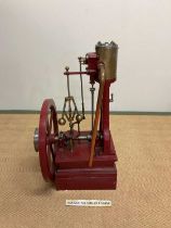 A large scratch-built static engine with six spoke side wheel and red painted main platform,