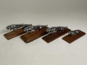 Four chrome Jaguar car mascots mounted on wooden plinths (4)