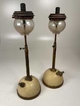A pair of Tilley lamps, globes marks Pyrex brand Tilley, height 60cm