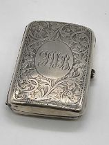 A George V hallmarked silver cigarette case of rounded rectangular form, Birmingham 1914, approx.