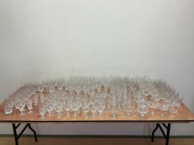 A very large quantity of glasses, in excess of 100, including champagne flutes, brandy balloons,