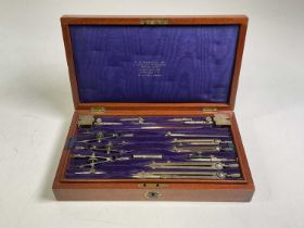 W. H. HARLING LTD; a mahogany cased set of early 20th century drawing instruments, the case and
