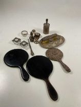 A small group of silver and white metal including a hand mirror, pepper, pair of glass salts, also