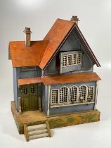 ALBIN SCHONHERR; a 'Red Roof' doll's house constructed as a single fronted chalet with blue walls