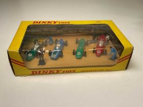 DINKY; a boxed presentation set of four racing cars with figures. Provenance: Messrs. Phillips