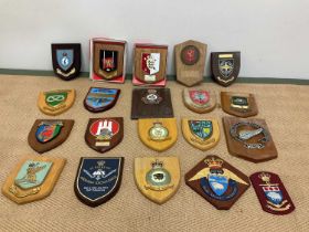 A collection of wooden shield plaques of rugby, athletic and Air Force interest.